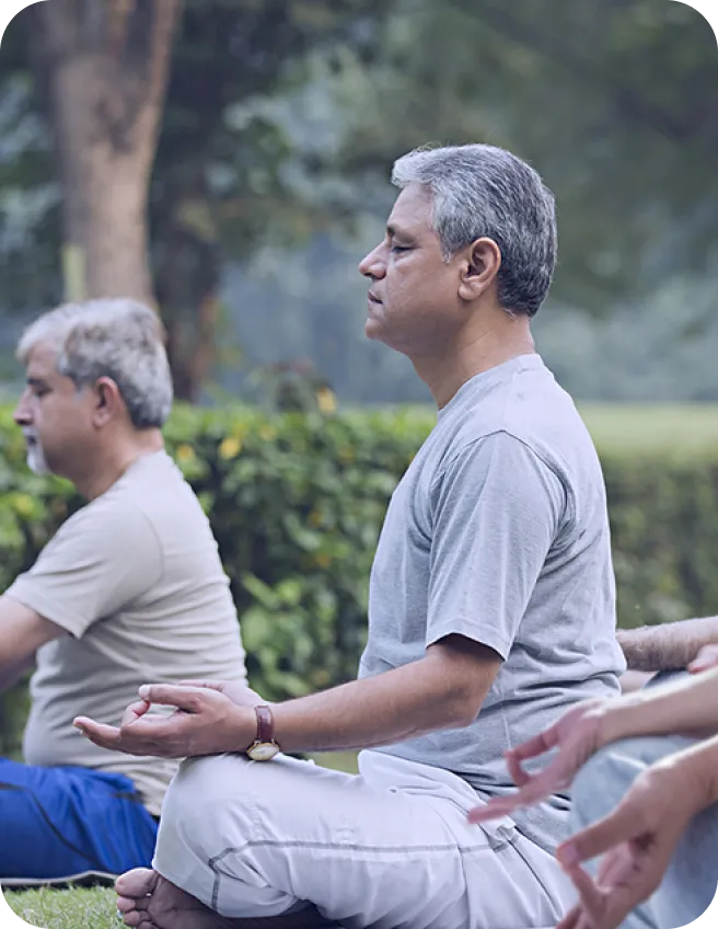People practising yoga outdoors